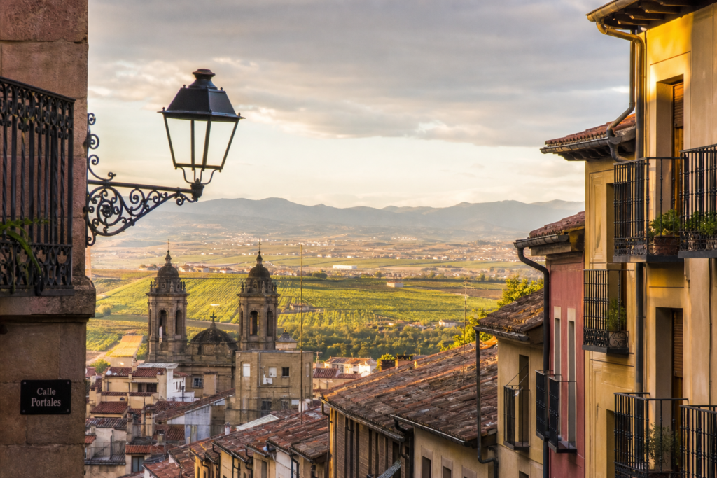 Historic Logroño street and La Rioja vineyards at golden hour