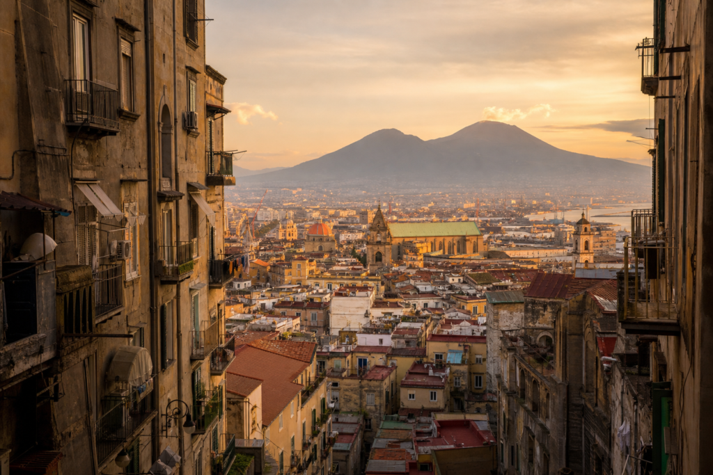 Historic Naples street with Mount Vesuvius in the distance at sunset