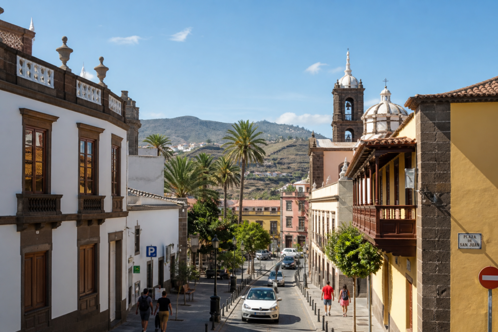 Street scene in Telde, Gran Canaria, with traditional Canarian architecture and palm trees
