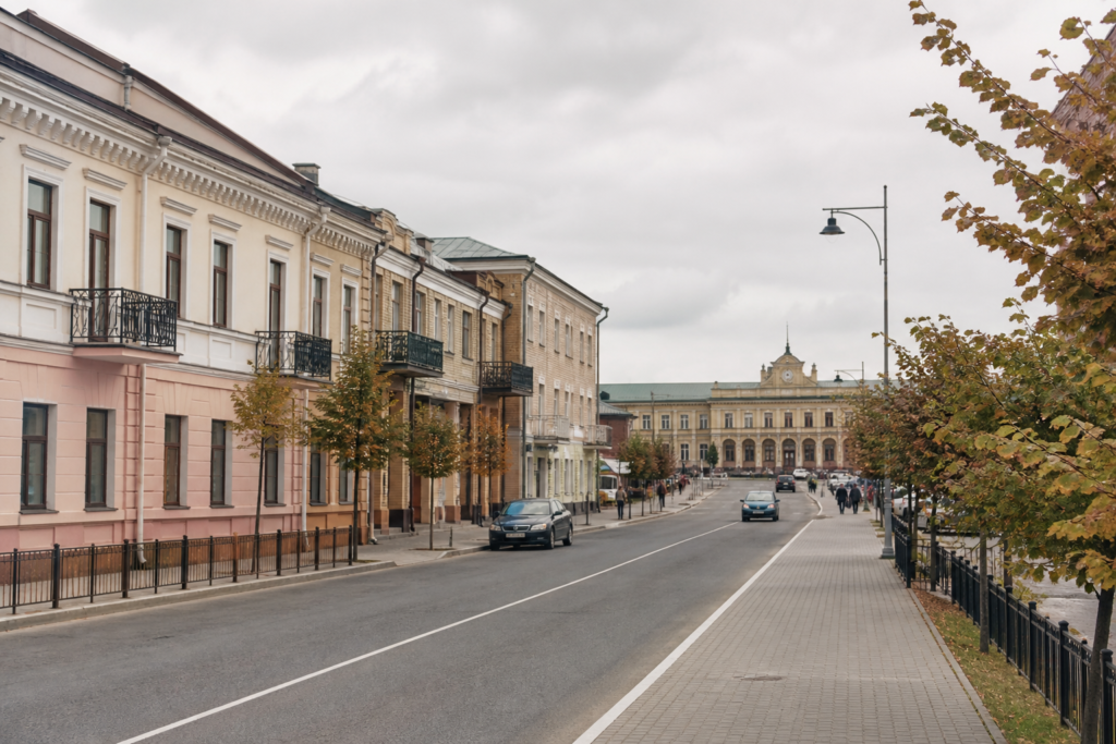A quiet street in Baranavichy, Belarus, with low-rise buildings under an overcast sky