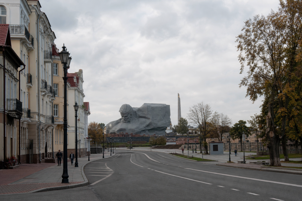 A quiet street in Brest, Belarus, with the Brest Fortress memorial in the distance