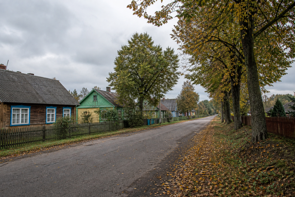 Quiet rural road and houses in a Belarusian settlement