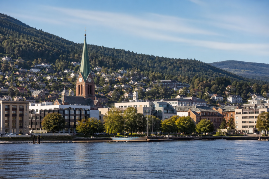View across the Drammenselva river toward Drammen and its surrounding hills in Norway
